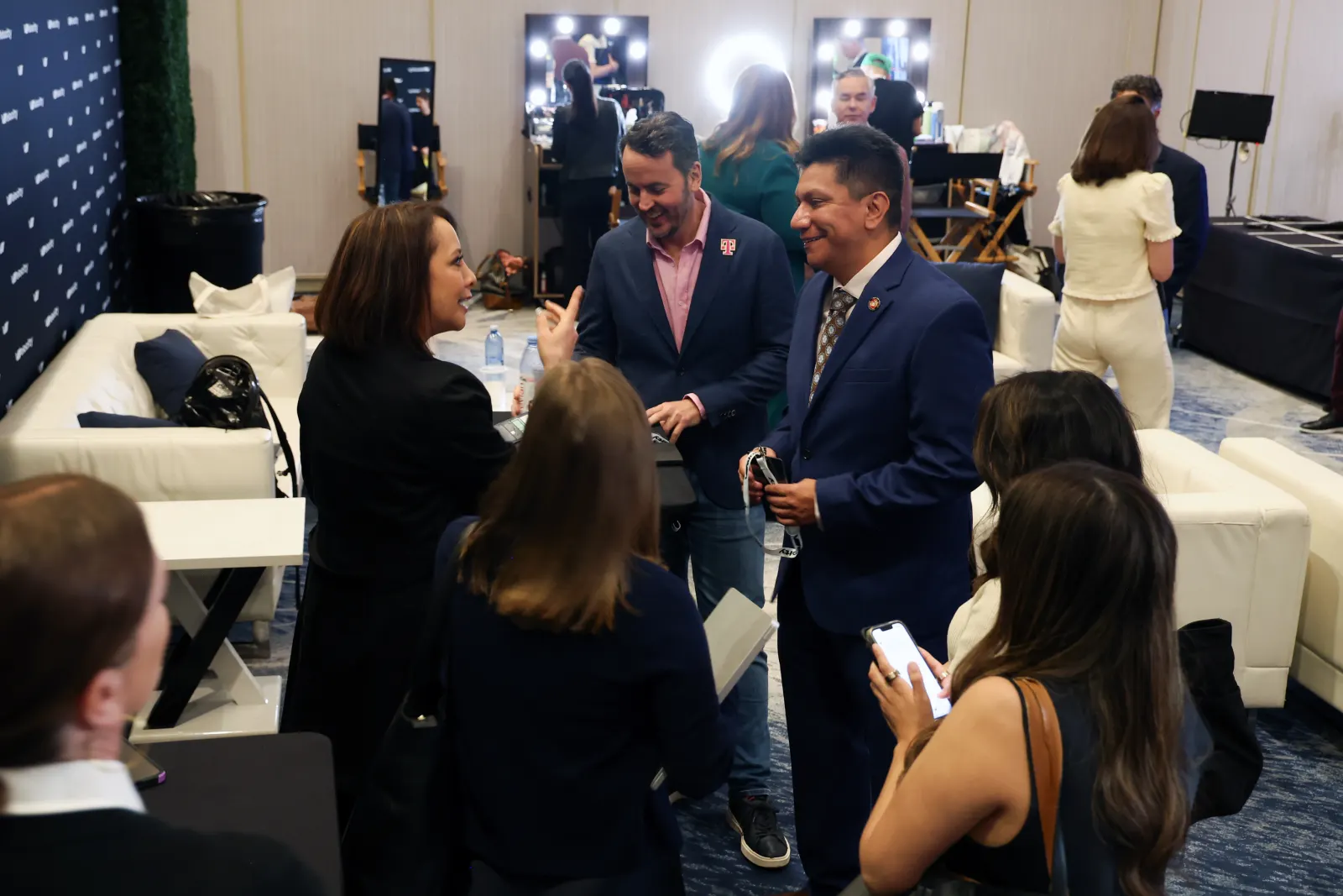 Conference attendees in conversation behind the scenes at Velocity 2025